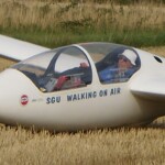 Field landing - the front seat pilot has taken the photo Field landing - the front seat pilot has taken the photo